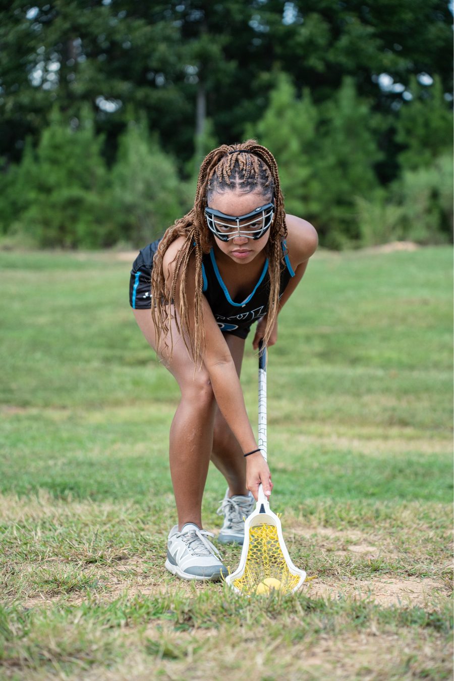 Ragen Giddens, Class of 2026 University of Oregon commit, fielding a ground ball in a Style Lacrosse uniform